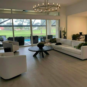 Side view of modern brass ring chandelier lighting design by Homevator